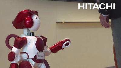 Emiew helps passengers at Tokyo International Airport.