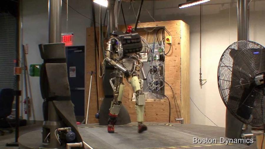 Petman walks, does squats and push-ups.