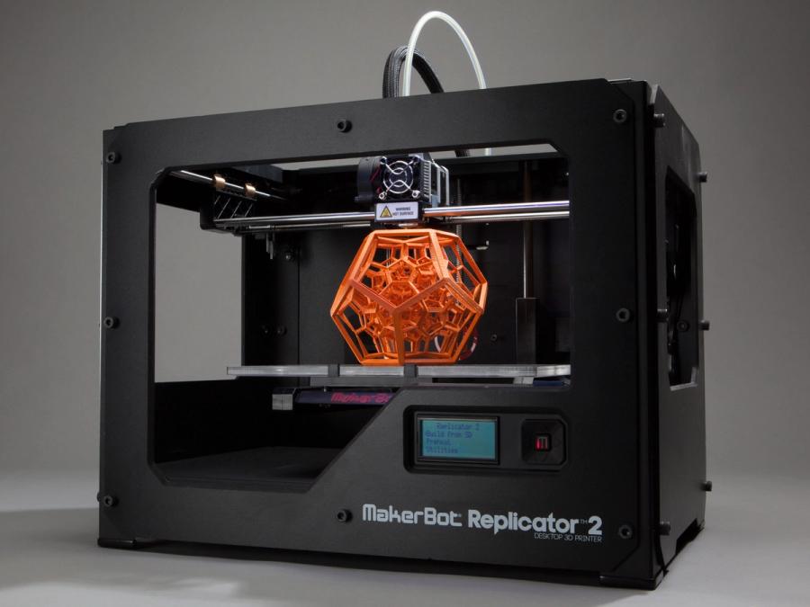 A black rectangular platform with a complex 3D printed dodecahedron.